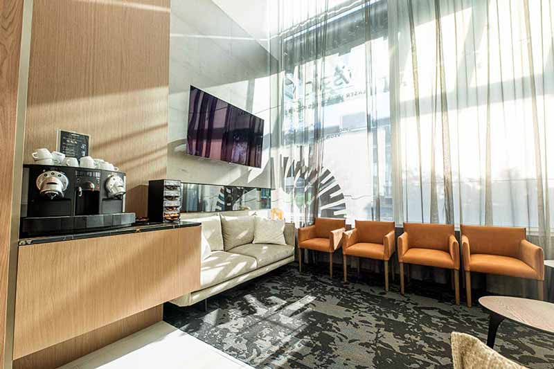 VSON laser eye surgery clinic coffee lounge with sofa, chairs, television and coffee machine