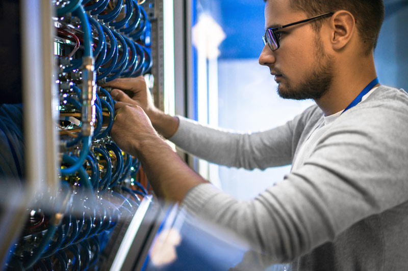 A technical worker performing a daily task at his office