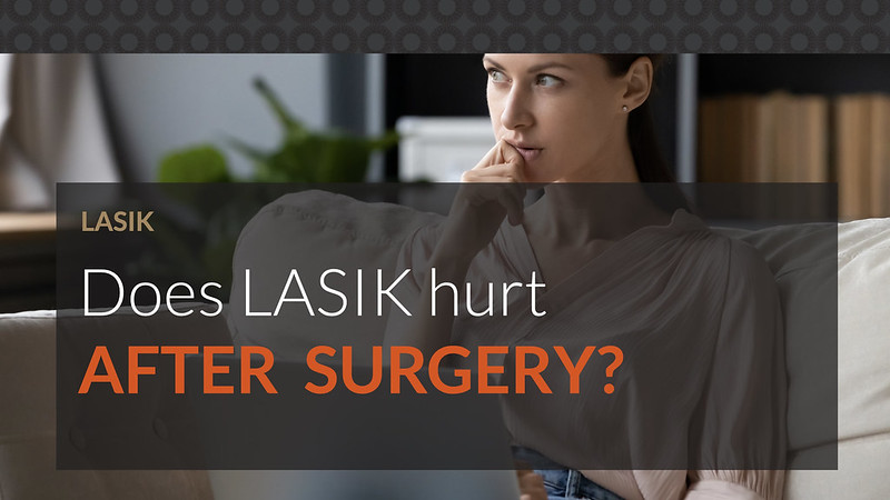 A woman using a laptop, thinking whether LASIK surgery hurts