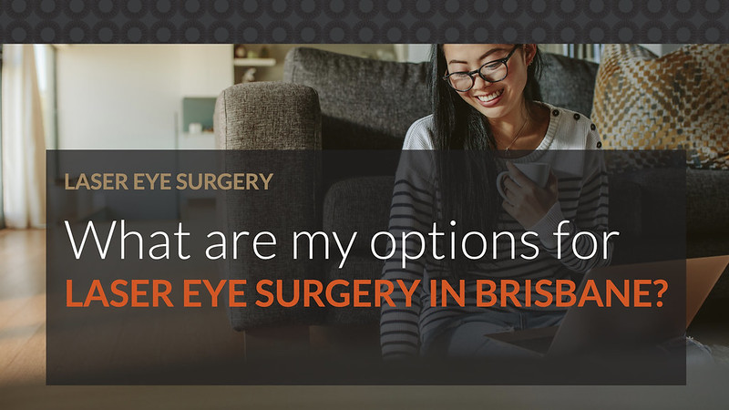 Young woman with glasses using her laptop to search for laser eye surgery options in Brisbane