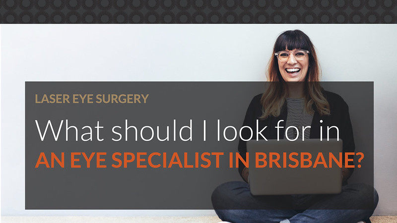 A middle-aged woman using a laptop to find out what she should look for in an eye specialist in Brisbane
