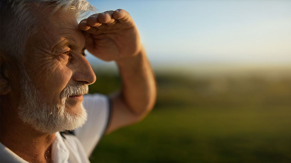 Senior man gazing at the sunset