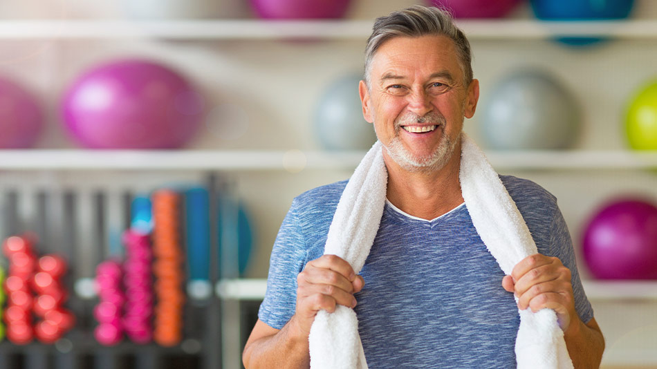 Senior man exercising in the gym