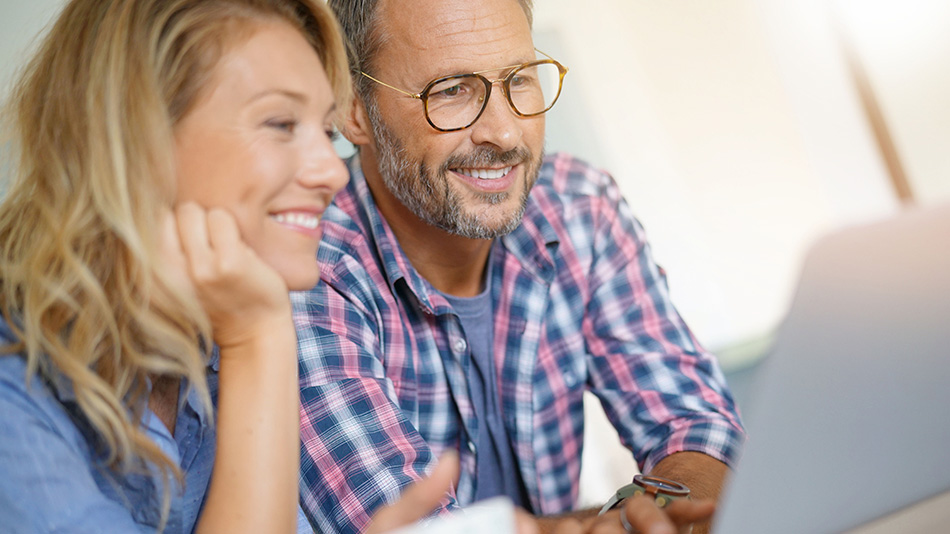 Middle-aged couple discovering Medicare coverage for lens replacement surgery.