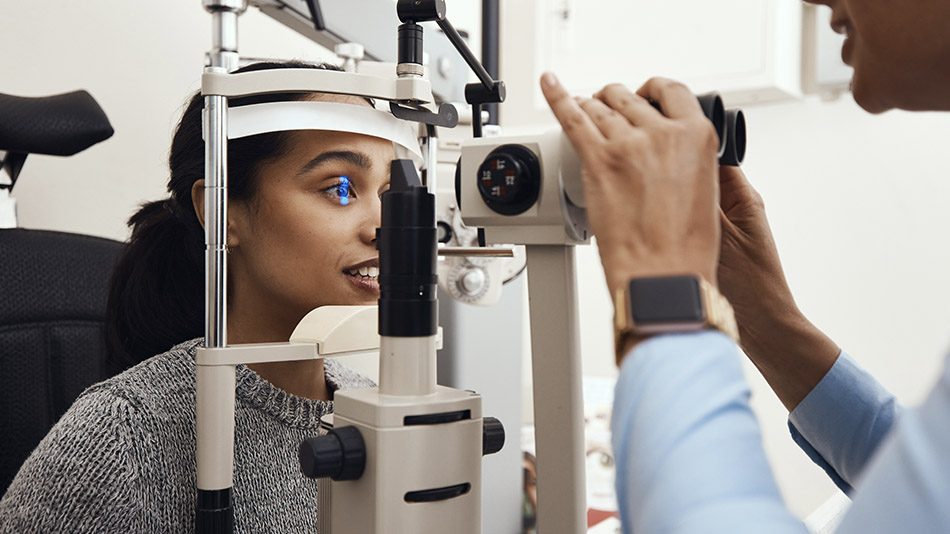 A young Indian woman having an eye exam.